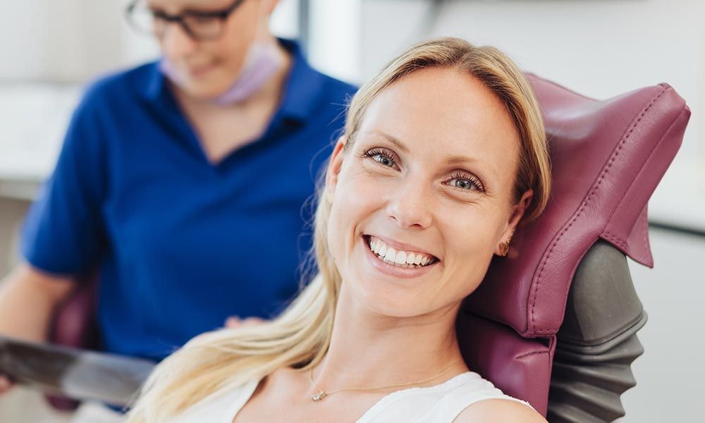 Smiling patient after dental sedation