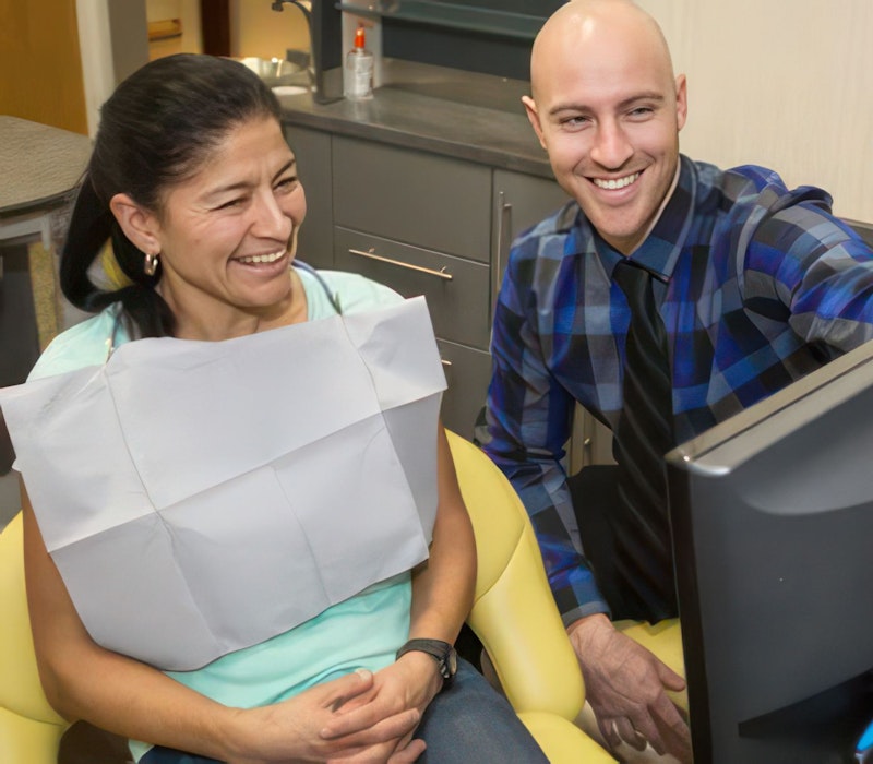 Pioneer Hills Dental doctor and dental patient smiling at a screen