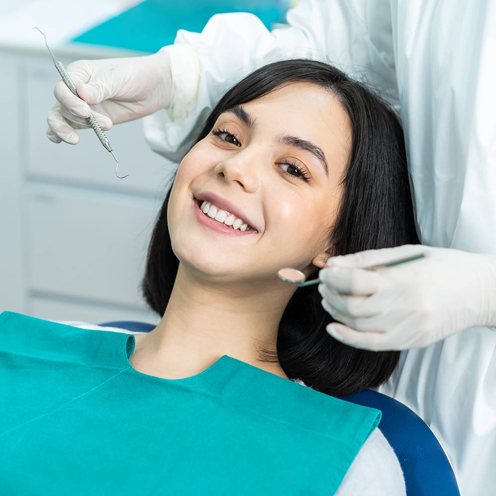 Smiling woman in dental chair